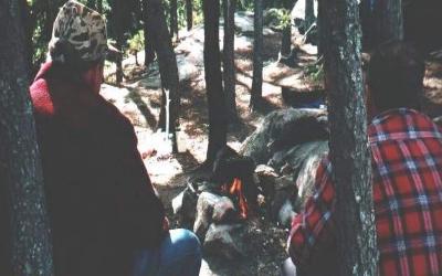 Sitting by the campfire in Woodland Caribou Park