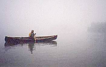 canoeing in morning mist, algonquin park, ontario