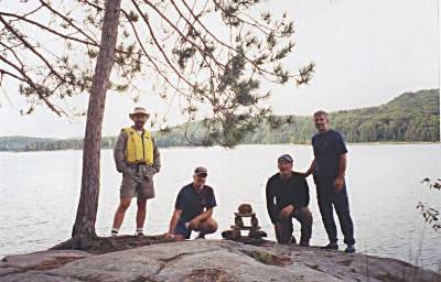 John, Norm R, Norm H and Wayne next to Inuksuk on Kioskkokwi Lake - Algonquin Park, Canada