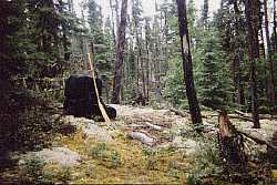caching a pack on a long portage - woodland caribou park canada